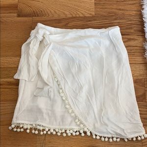 emory park white wrap skirt w/ pom pom